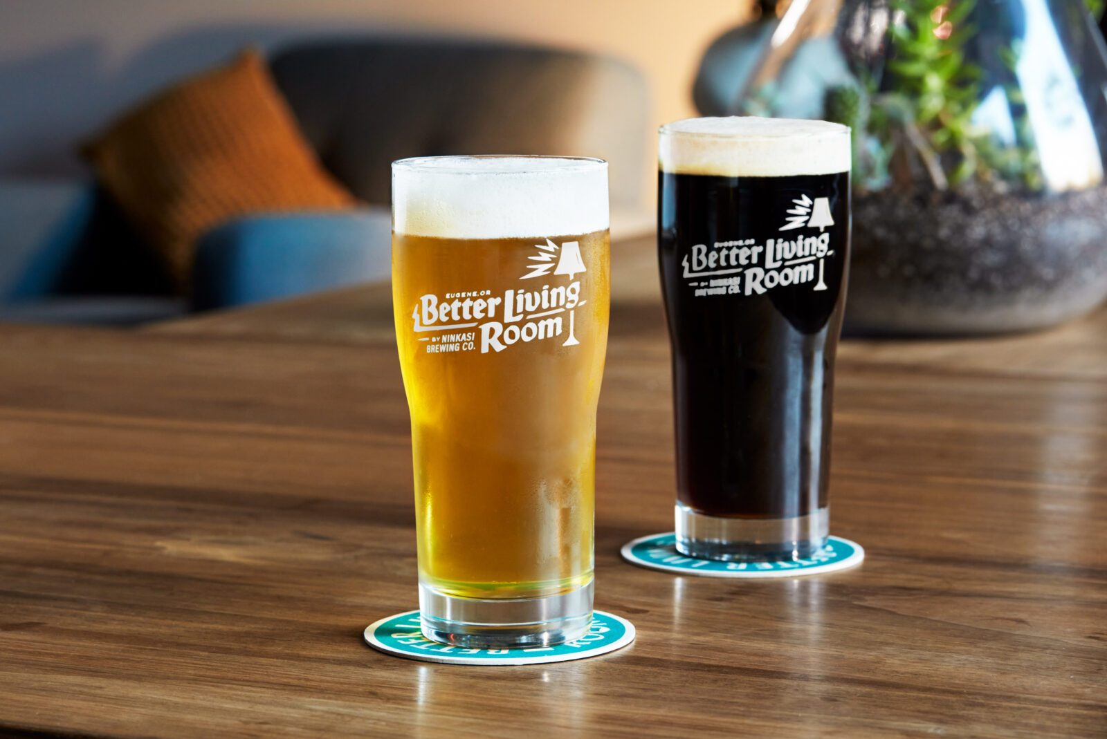 Two pints of beer with Better Living Room Logo
