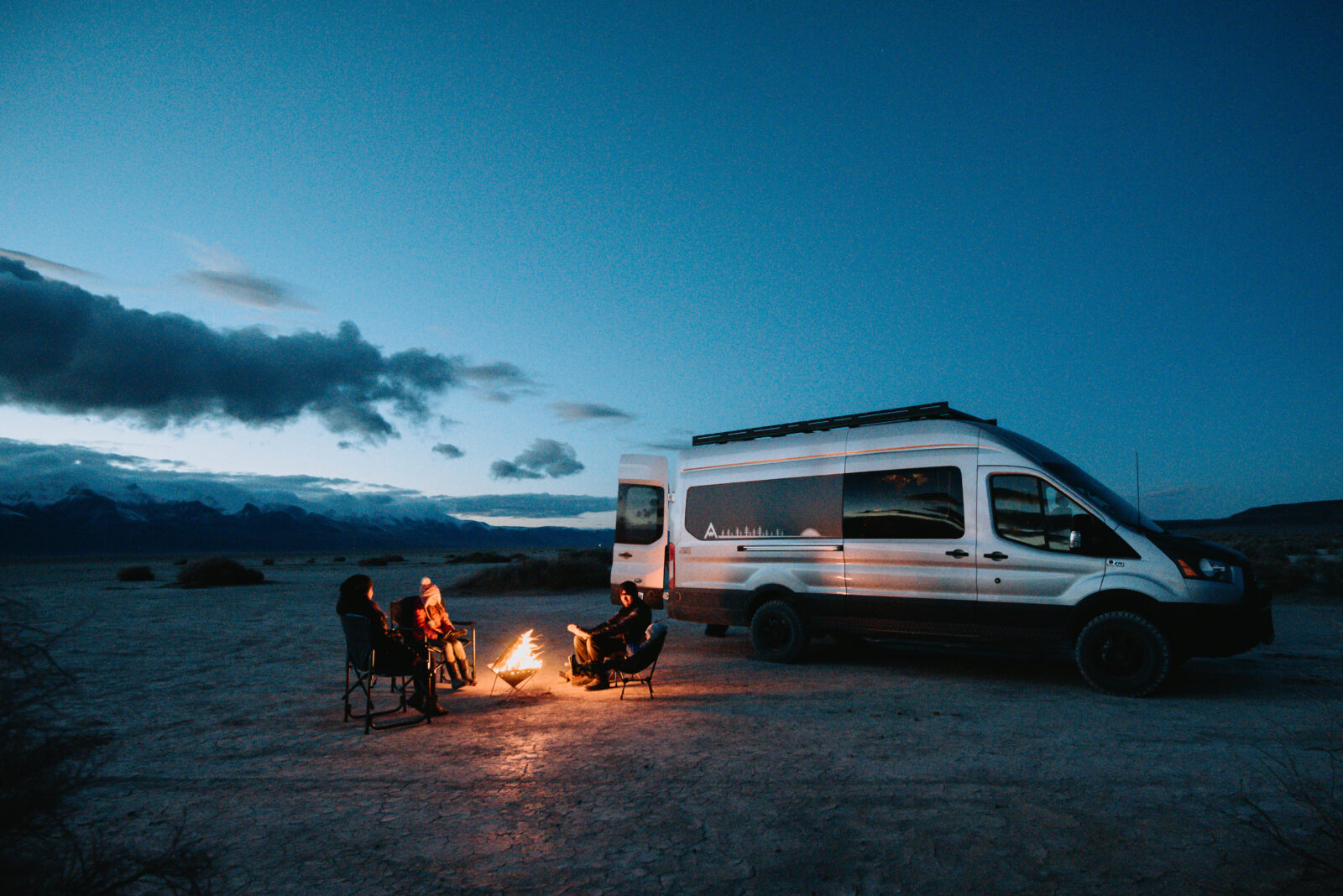 Two people camping outside